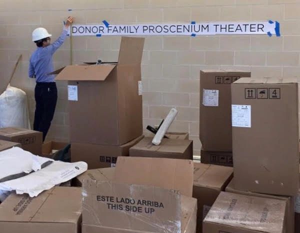 Theater naming installation in progress.